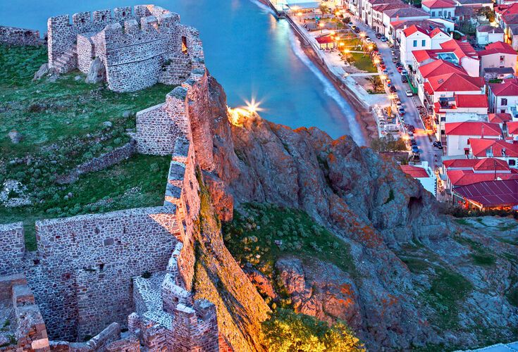 Partial view of the town of Myrina, its castle and the beach you of Romeikos Gyalos