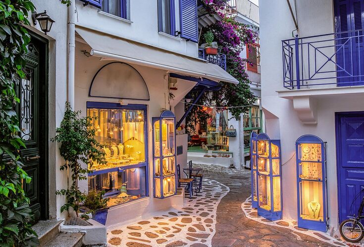 Town of Skiathos with whitewashed houses and red tiled roofs between the narrow streets