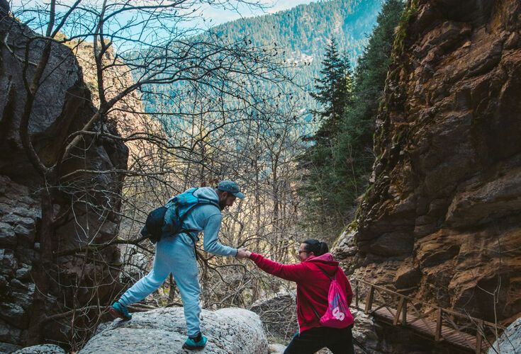 Trek across wooden bridges and past little waterfalls