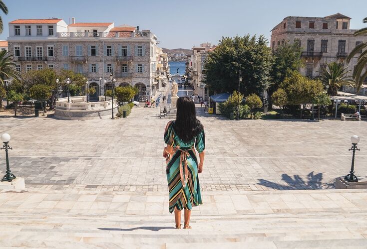 Miaouli Square with its grand Town Hall, palm trees and cafes and shops