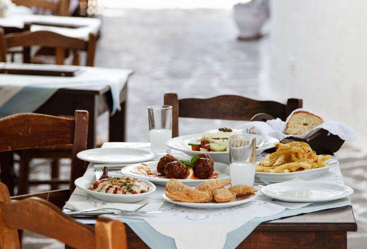 Enjoy local dishes in a traditional taverna in Plaka