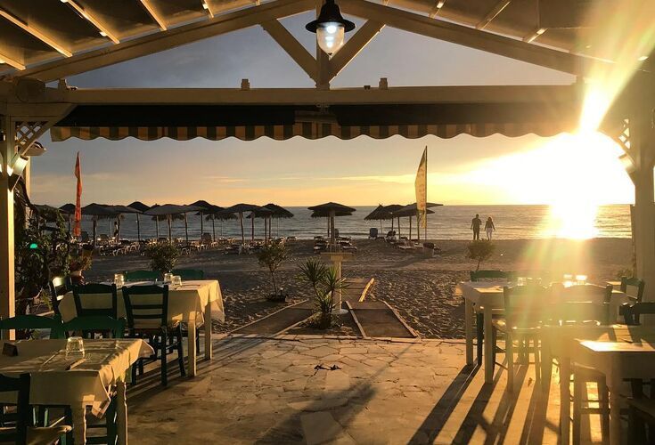 A sunset dinner at Potos beach