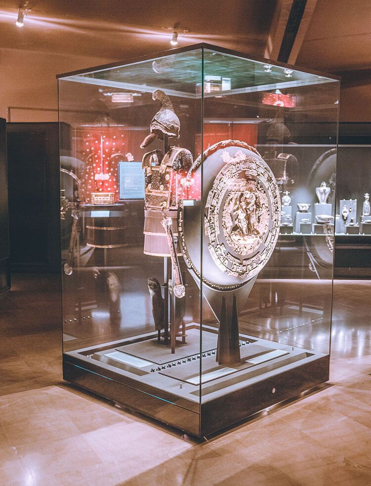 The immense armour of King Philip II, displayed in evocatively dimmed light