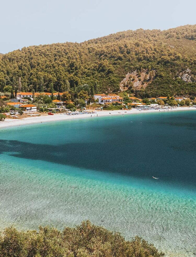 In a setting of tranquil green and blue, Panormos is one of the most welcoming beaches in Skopelos