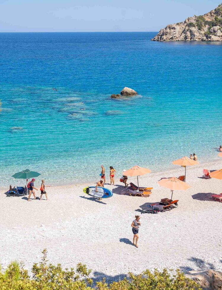 Apella is a setting of pine-tree green, white sand and deep blue sea