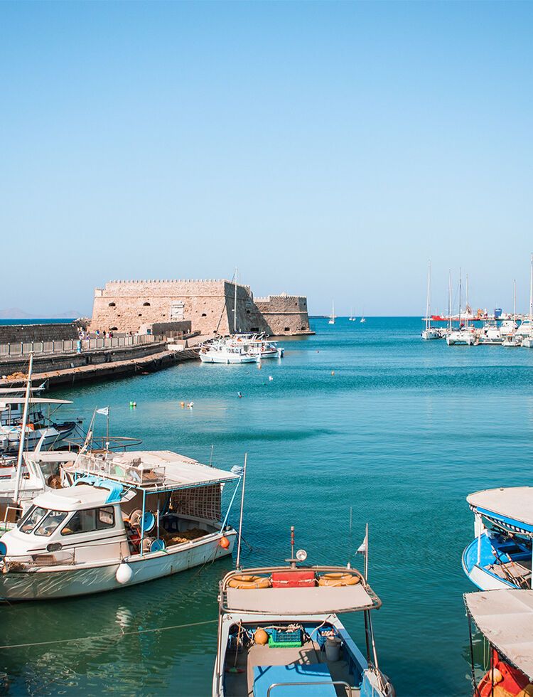 Fishing boats by Koules Fortress in the harbour of Heraklion old town