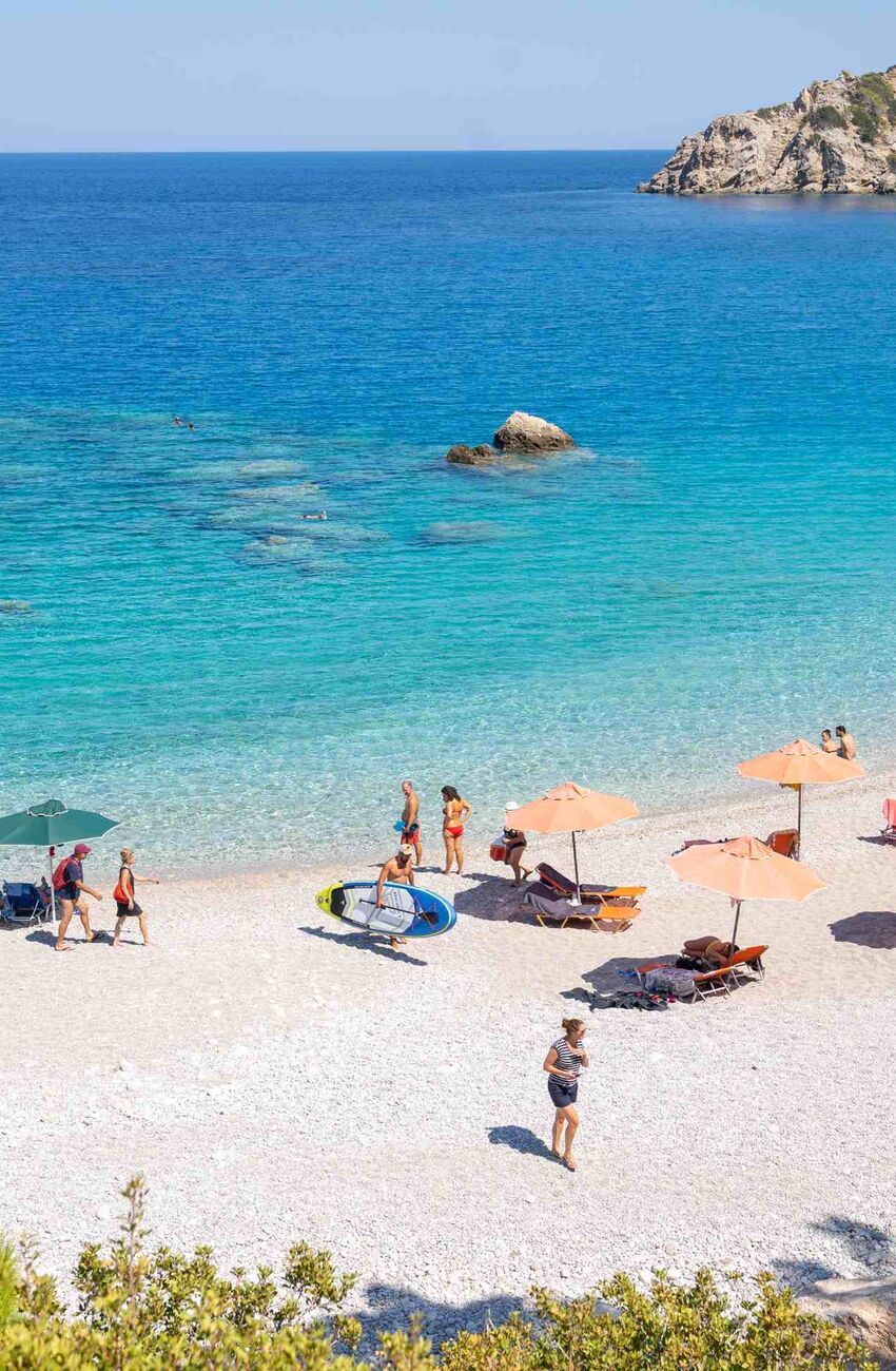 Apella is a setting of pine-tree green, white sand and deep blue sea