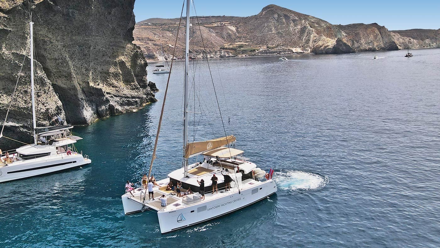 catamaran-santorini-day-cruise-swim-stops-food-drinks-and-transfers-2-logo