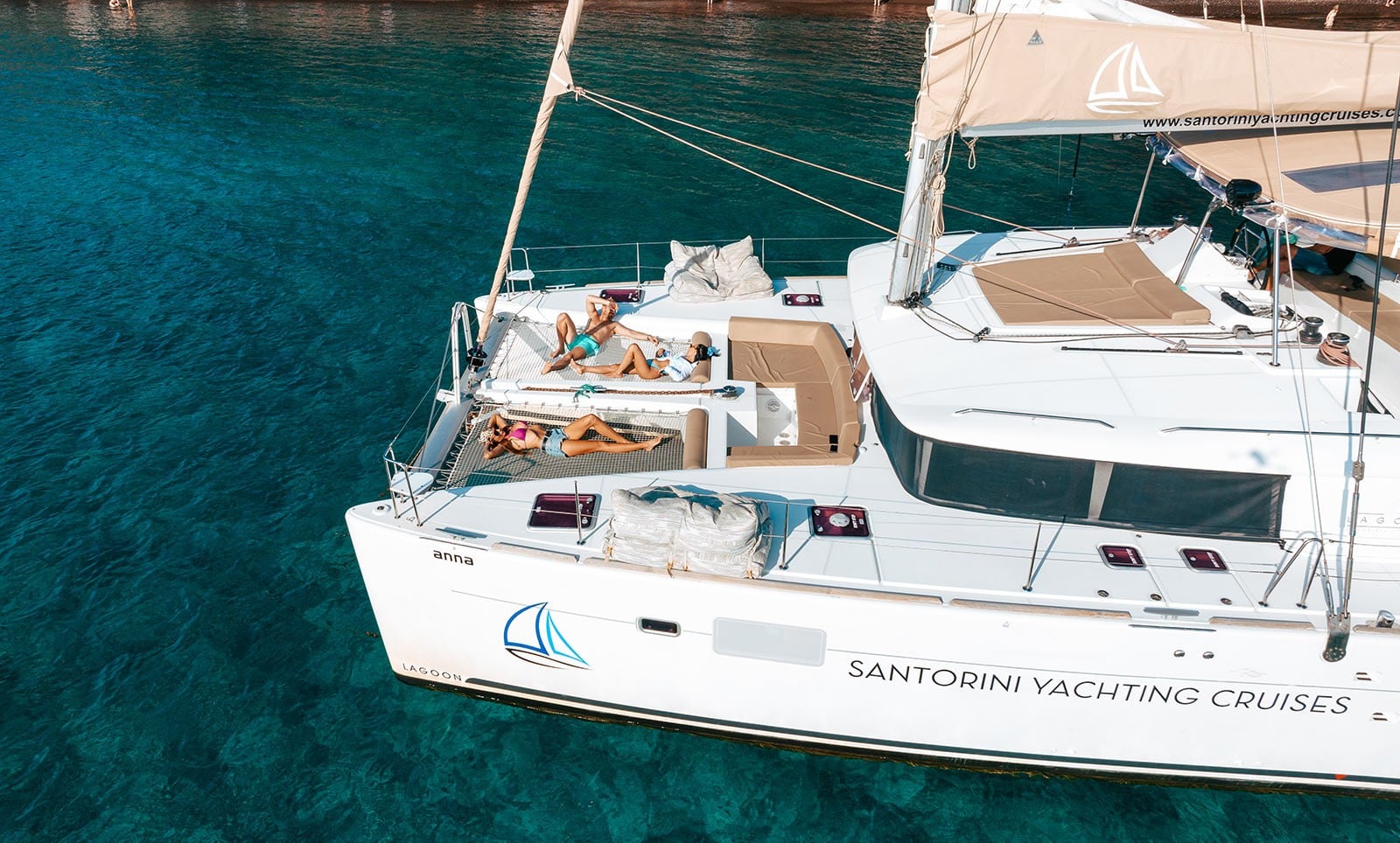 catamaran-santorini-day-cruise-swim-stops-food-drinks-and-transfers-3-logo