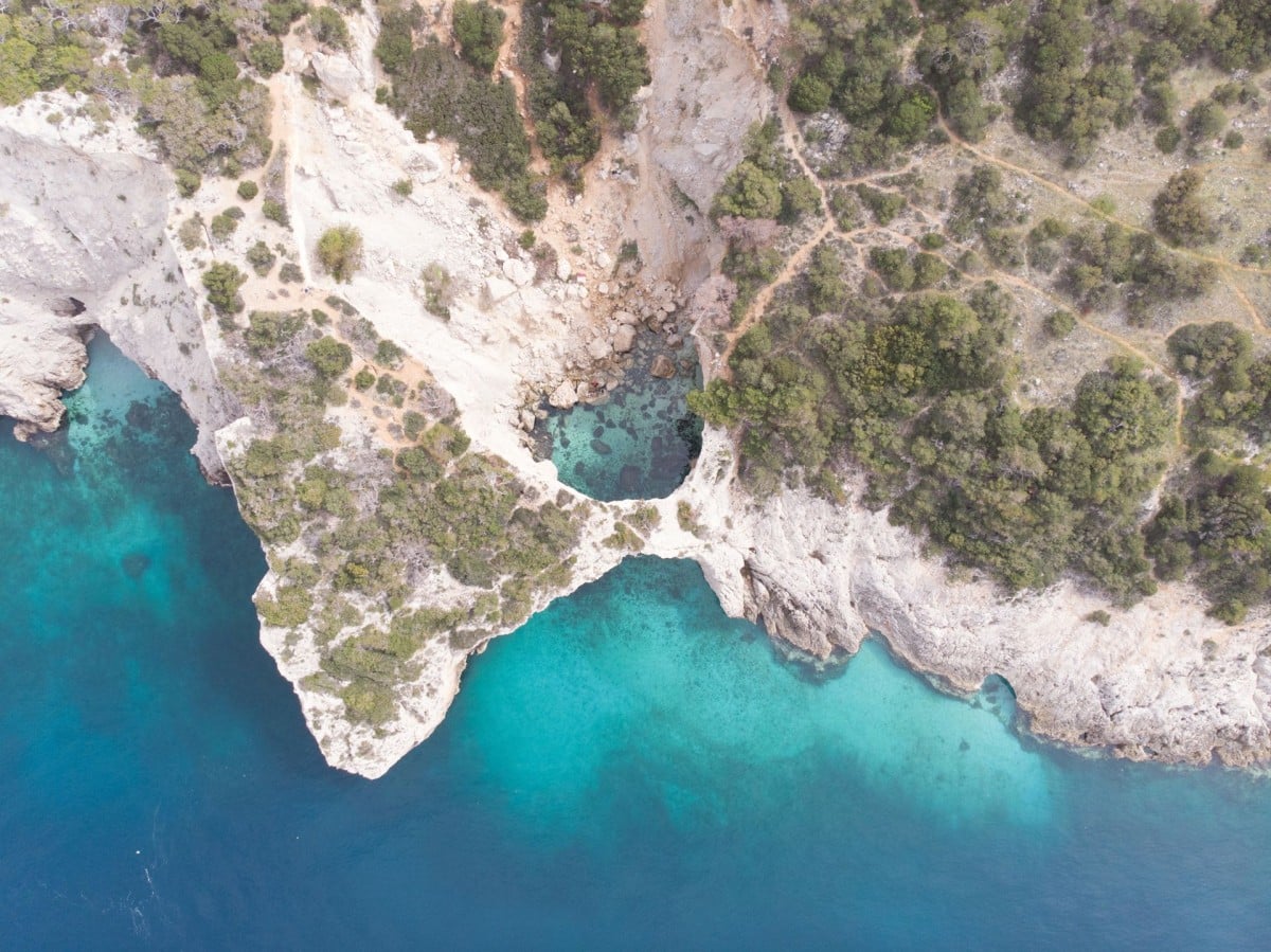 corinthia-full-day-canyoning-in-pissia-gorge-coastal-hike-to-seal-cave-with-swimming-logo