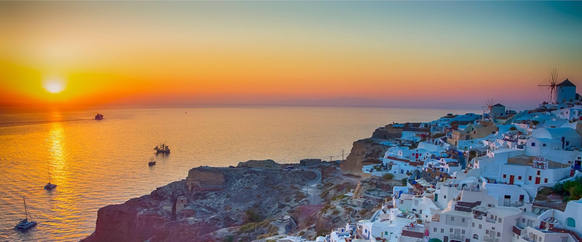 private-santorini-sunset-sailing-adventure-explore-swim-and-dine-on-a-luxurious-catamaran-logo