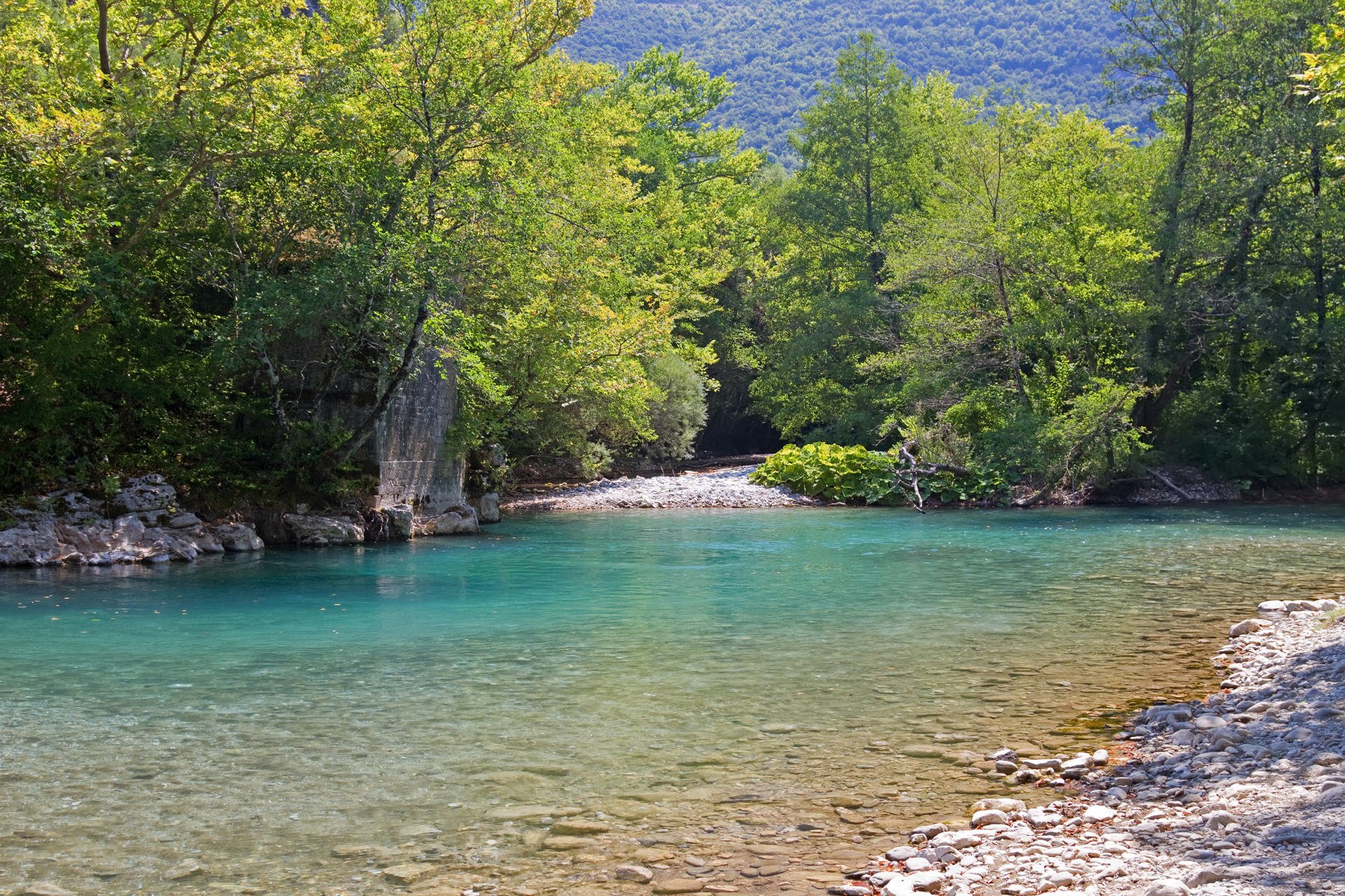  The blue waters of Voidomatis river that flows through Epirus region, Greece