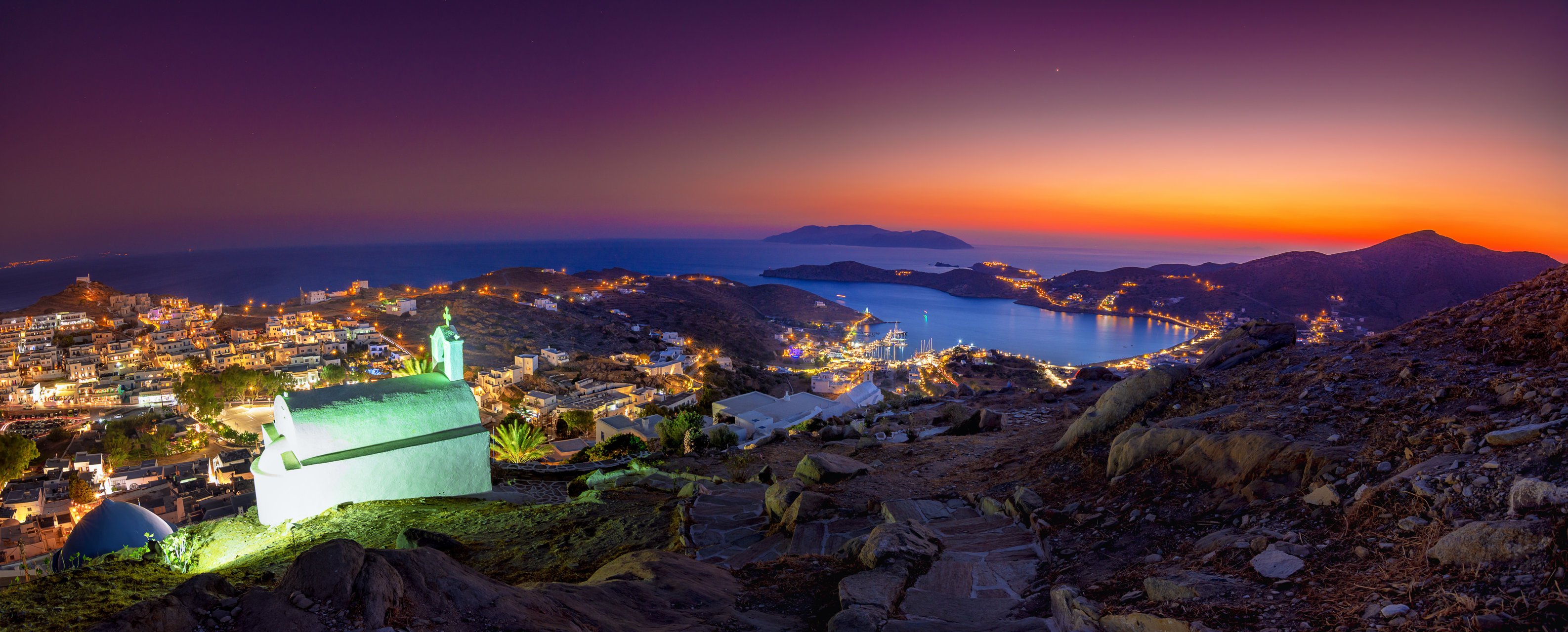 Panorama of Ios Chora and old harbor at sumset, Cyclades